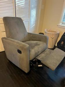 Grey rocking recliner armchair